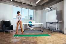 Load image into Gallery viewer, Man practicing golf putts on PUTT-A-BOUT Par 1 &quot;360&quot; Putting Mat in office setting
